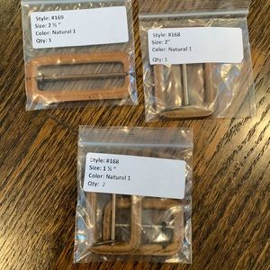 Leather wrapped belt buckles